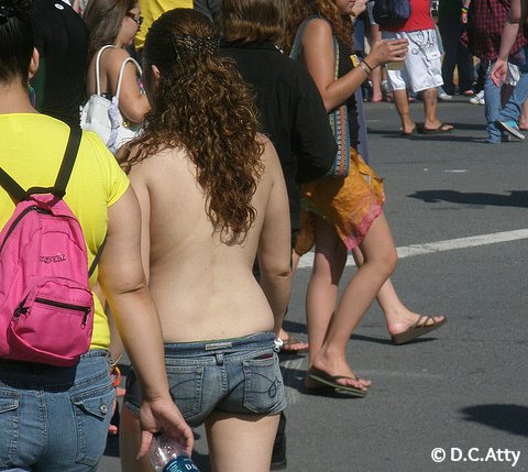 topless girl at a busy road